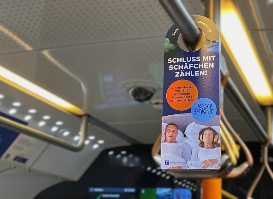 Bewerbung einer Messe auf einer Swing Card.